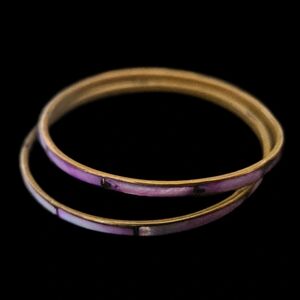 Set of two. Beautiful shades of Purple dyed shells inlaid into brass bangles.